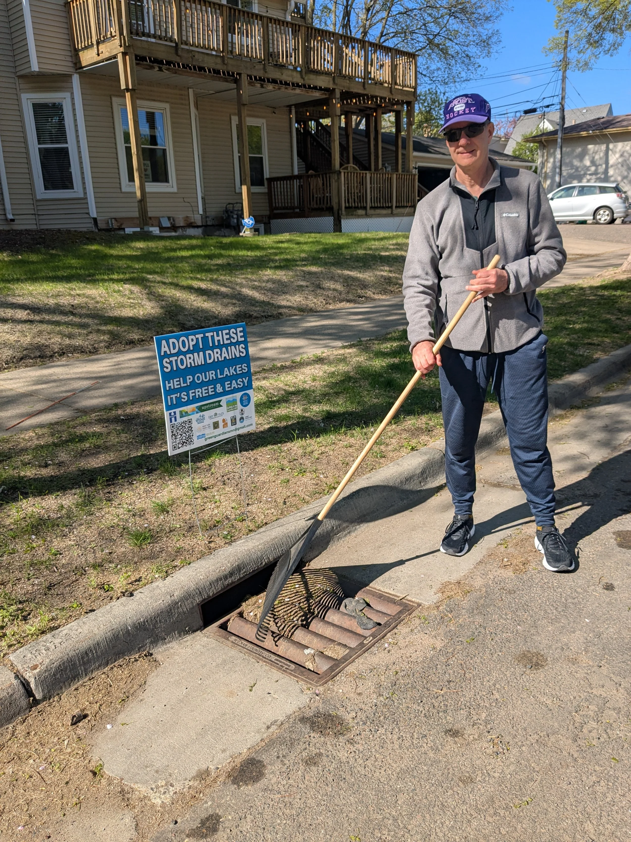 Adopt a Drain- person-raking.jpg.jpeg