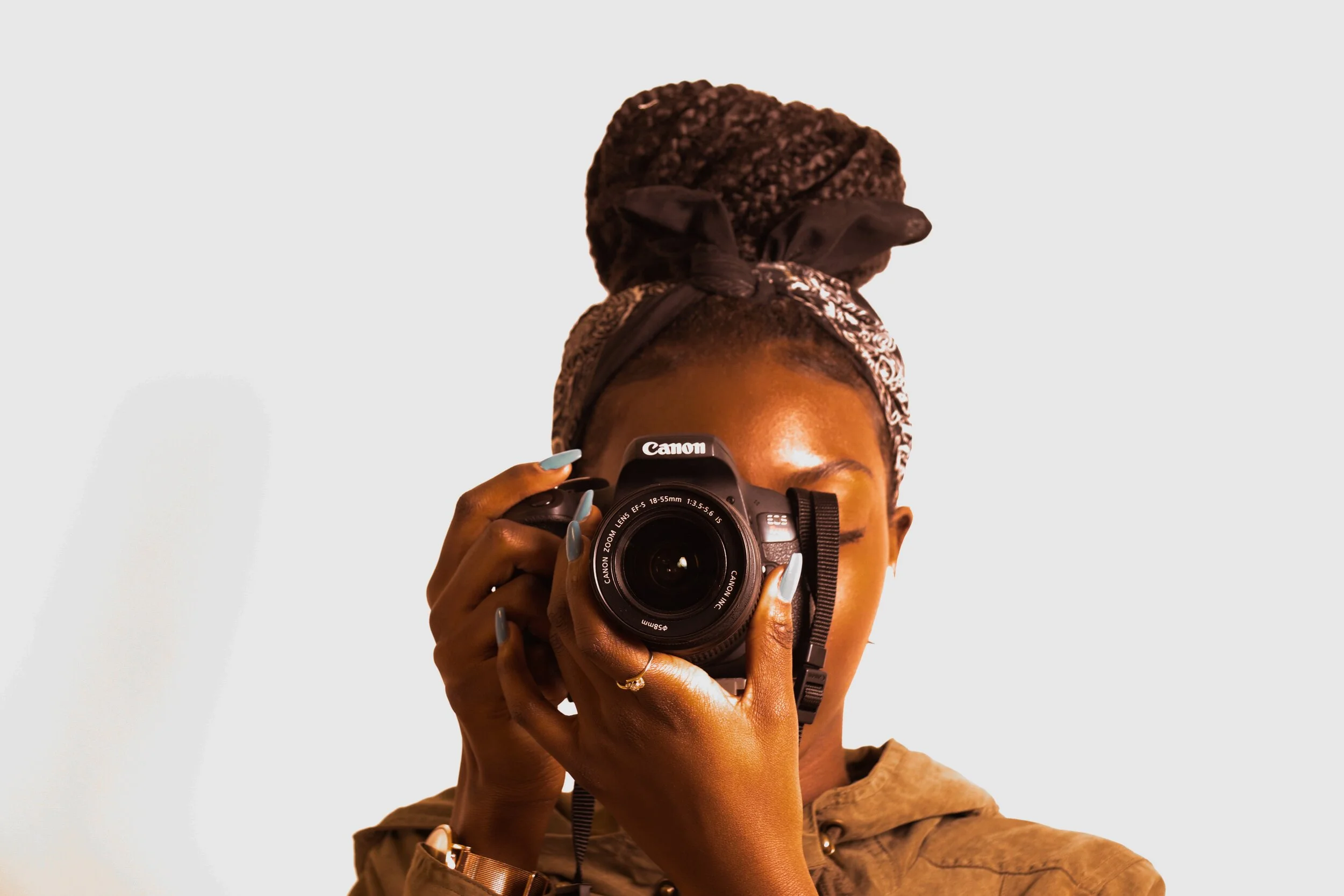 woman-using-canon-dslr-camera-1903308.jpg