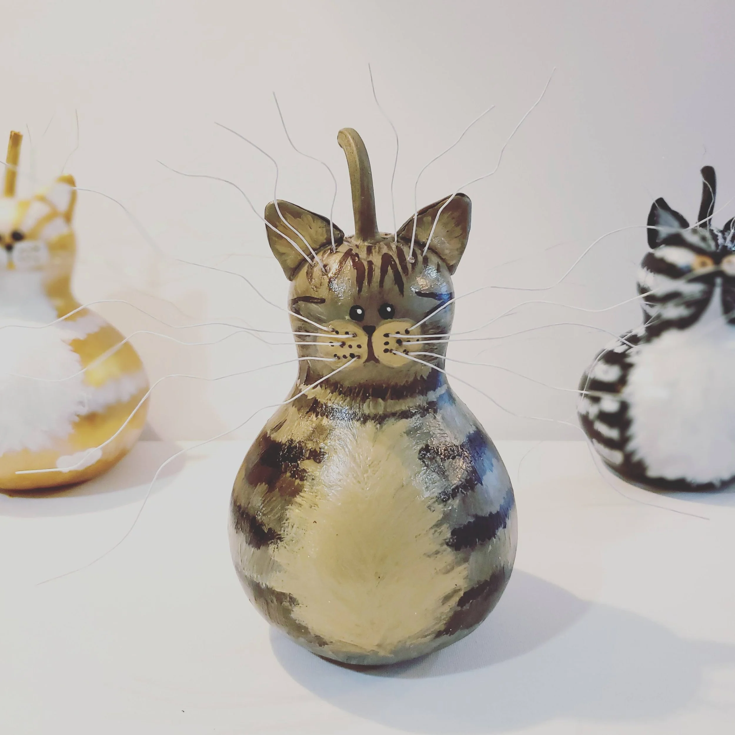 Image of 3 large gourd cat statues
