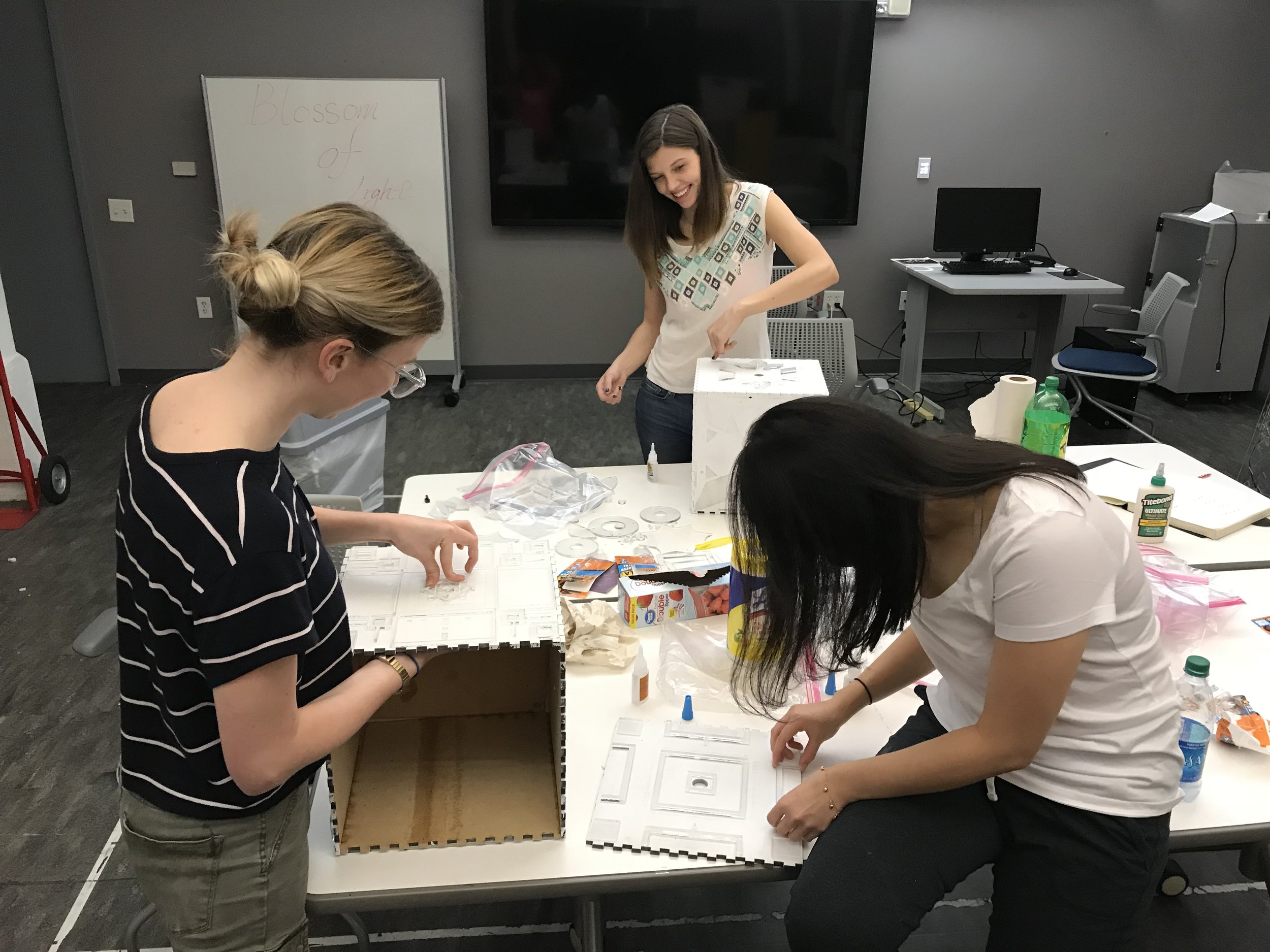 Gluing together the cubes and adding the acrylic details. Thanks Madison and Eleena for your hard work and helping hands!