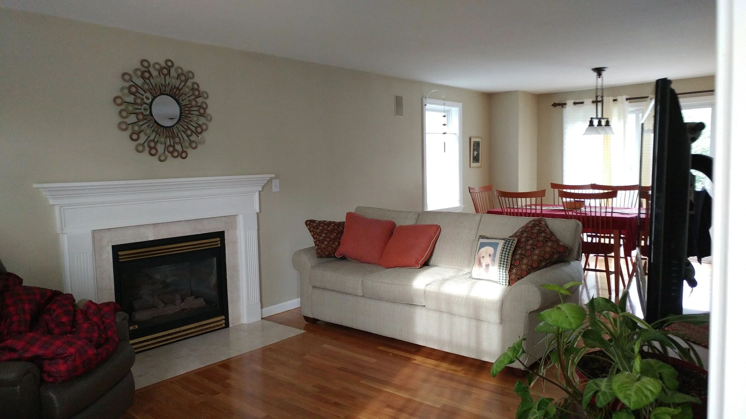 BEFORE: This is a living room whose wall color was pleasantly neutral and the floors newly refinished…the perfect backdrop for a transformation. I shopped with the client to bring in new, scaled furniture and from there the makeover began.