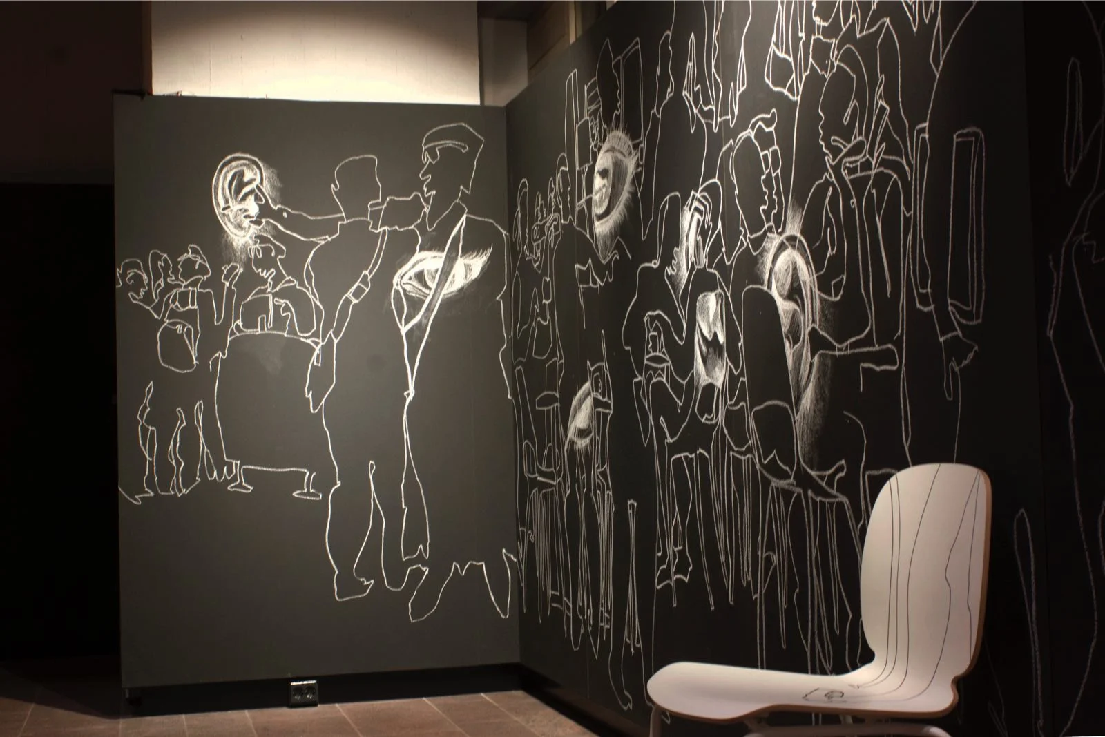 Chair Connection happens everywhere. People connect with people , with objects, with their own feelings. A chair can be connected through human activity. Here, a white chair interacts with the wall drawing, illustrating the relationship between individuals and objects