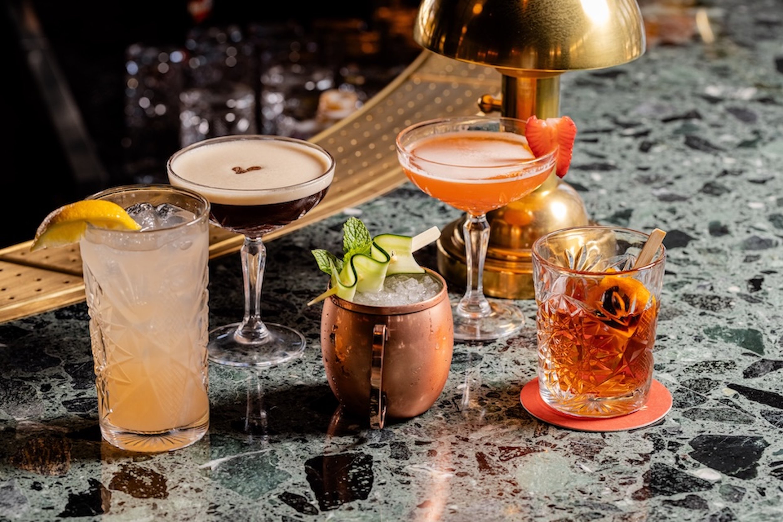UB McKinney - Cocktail group on bar.jpg