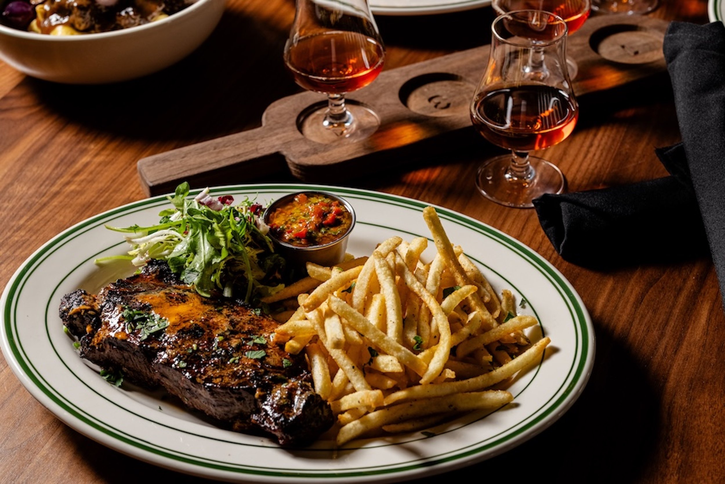 UB MckInney - NY Strip with whiskey paddle.jpg