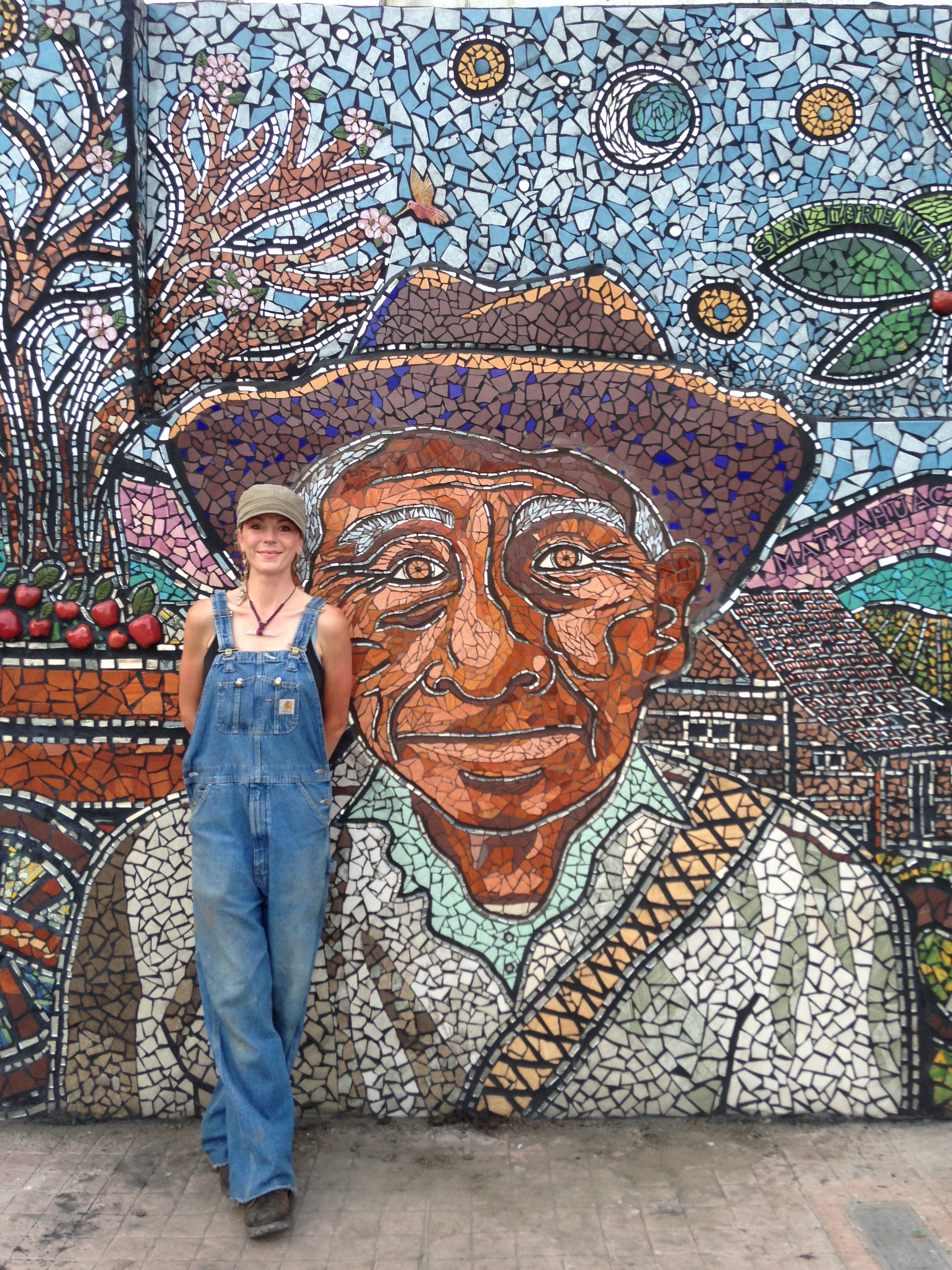 Artist Trish Metzner with portrait of the imaginary Don Tacho