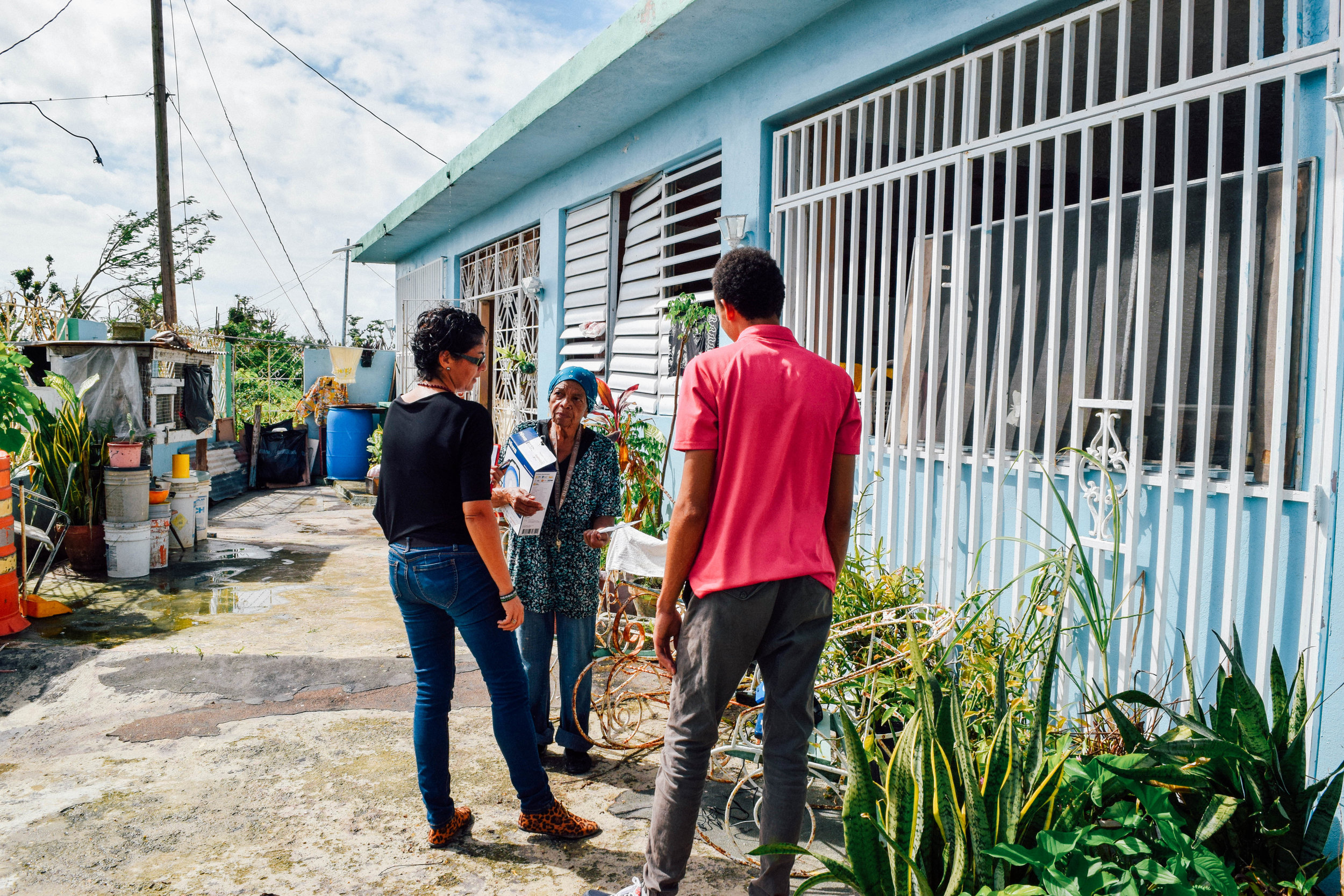 She was very grateful but apparently confused, despite our efforts to explain about and set up the lantern, because after we had left her, she stopped us as we passed her on our way to another street to ask how the “hot plate” worked. She had assumed it was to heat her food. The municipality of Humacao is where the hurricane made landfall and this community in Punta Santiago was very hard hit. Adding to the desperateness of the situation, the neighborhood where this woman lives is full of, like her, many elderly people who live alone.