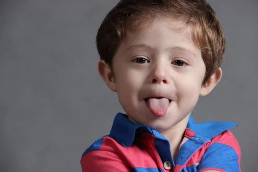 Boy sticking his tongue out