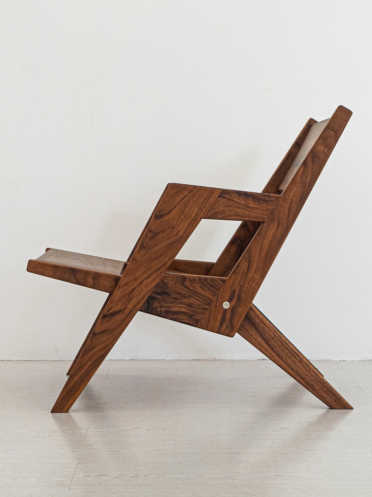 After making the templates freely available for 5 years, I decided to build a copy of the folding chair in walnut and offer it for sale! I consider it a fancier remake, with expensive wood, hidden joinery, rounded edges and a smoother feel. This is a