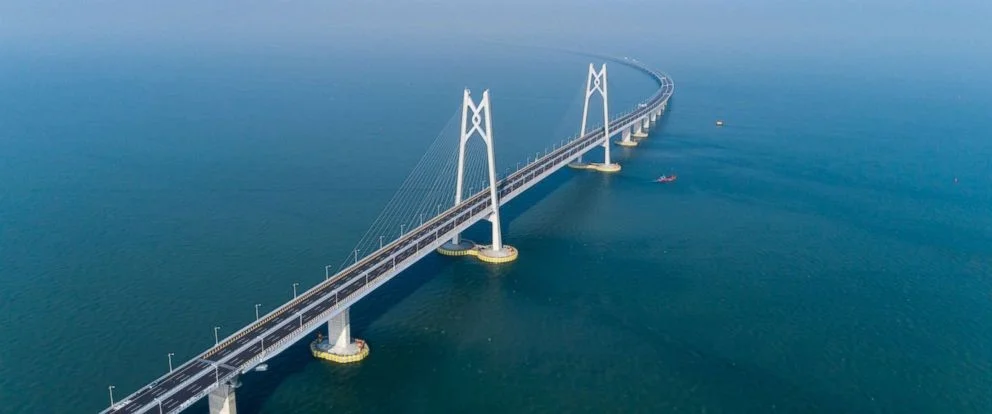 CHINA BRIDGING THE GAP TO HONG KONG - A WASTE OF MONEY? On 23rd October 2018, China officially opened the Hong-Kong-Zhuhai-Macau Bridge, which linked mainland China, and the two administrative regions, Hong Kong and Macau. Spanning 55km, the largest sea bridge to ever be constructed, and costing a grand total of $20bn, the link is said to bring greater… By Alistair Law