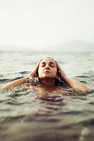 woman+surfacing+from+water.jpg