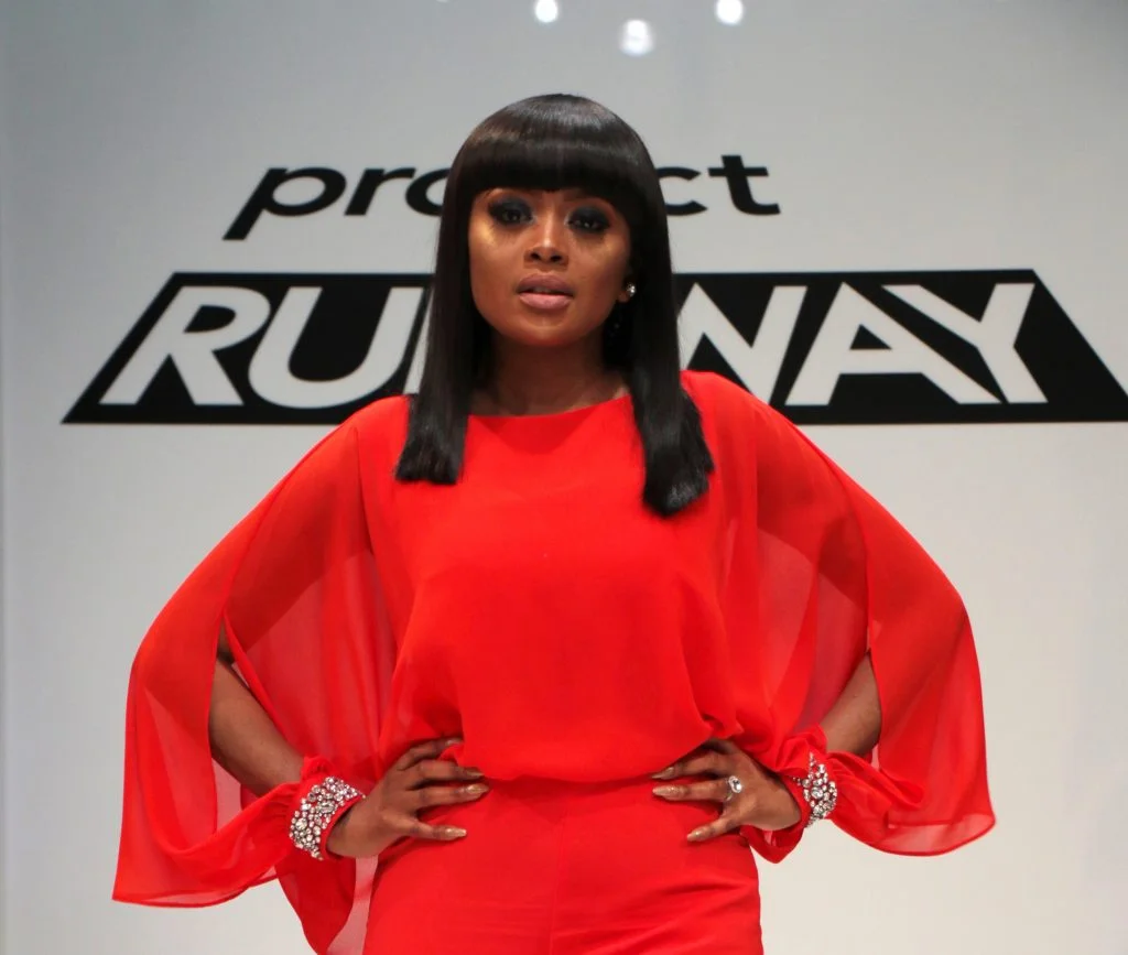 BRIEF EXCERPT COURTESY OF ELLE SA: "As Project Runway SA’s host, Kganyago will be leading South African audiences through the adventures, dramas and stories as they unfold onscreen; she’s the one who will be heading Noni Gasa and Rahim Rawjee as the panel of expert judges; and while she’s the one who will be eliminating contestants at the end of each episode, she’s also the one who will be nurturing their talent alongside Project Runway SA’s mentor Gert-Johan Coetzee. “I am going to be encouraging the designers to cut out the noise and to follow their inner voice”, says Kganyago. Whether she’s in the boardroom or on stage in power suits, ball gowns, or a pair of jeans and a t-shirt, Kganyago has always seen fashion as a canvas for the people. “We live in a very visual time, and the clothes we choose to wear – and how we put them together – become a billboard of who we really are.”