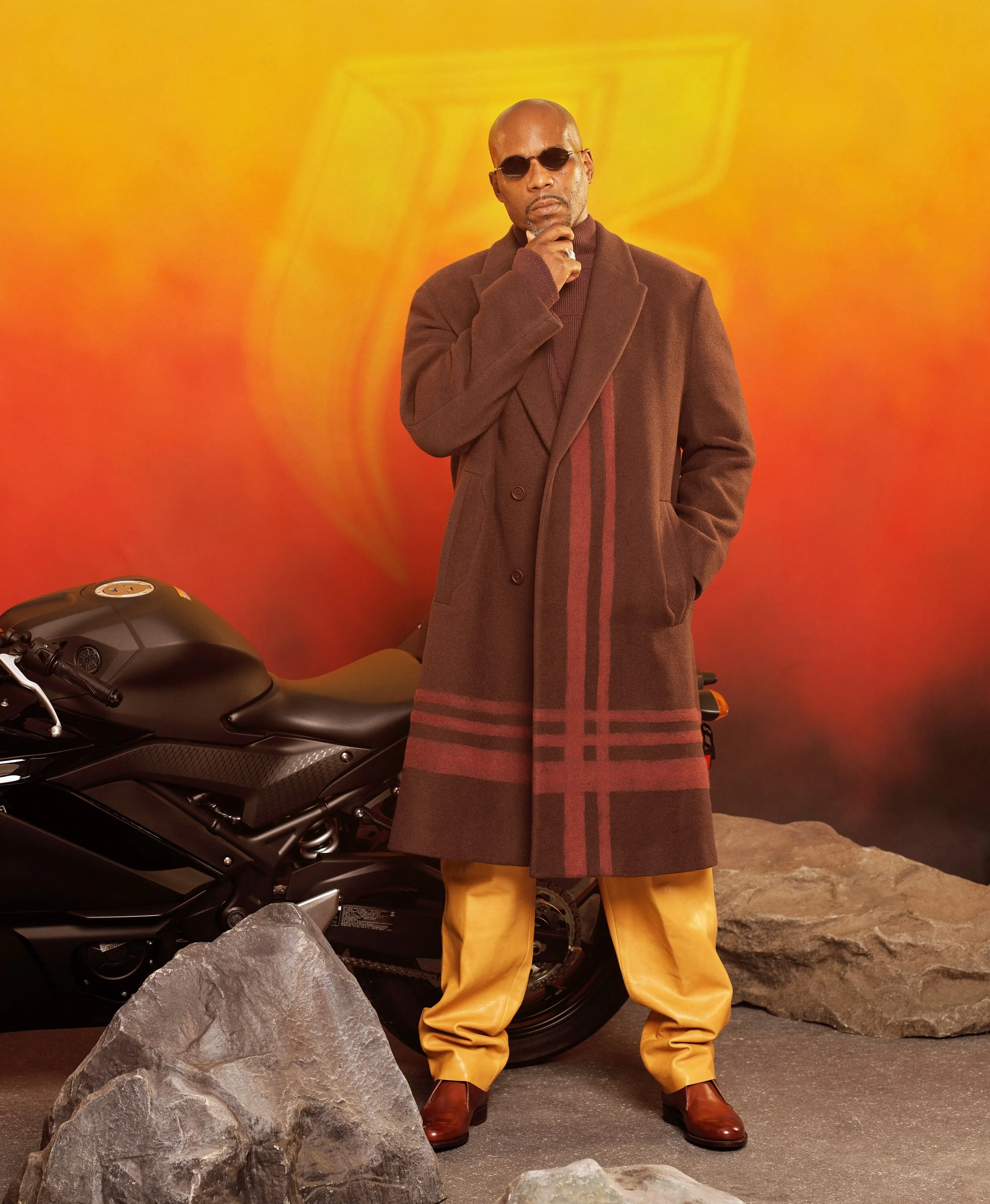 Coat, $6,950, and sweater, $2,250, by Ermenegildo Zegna XXX / Pants, $8,550, by Hermès / Shoes, (price upon request), by Isaia / Sunglasses, $475, by Linda Farrow / Ring, his own