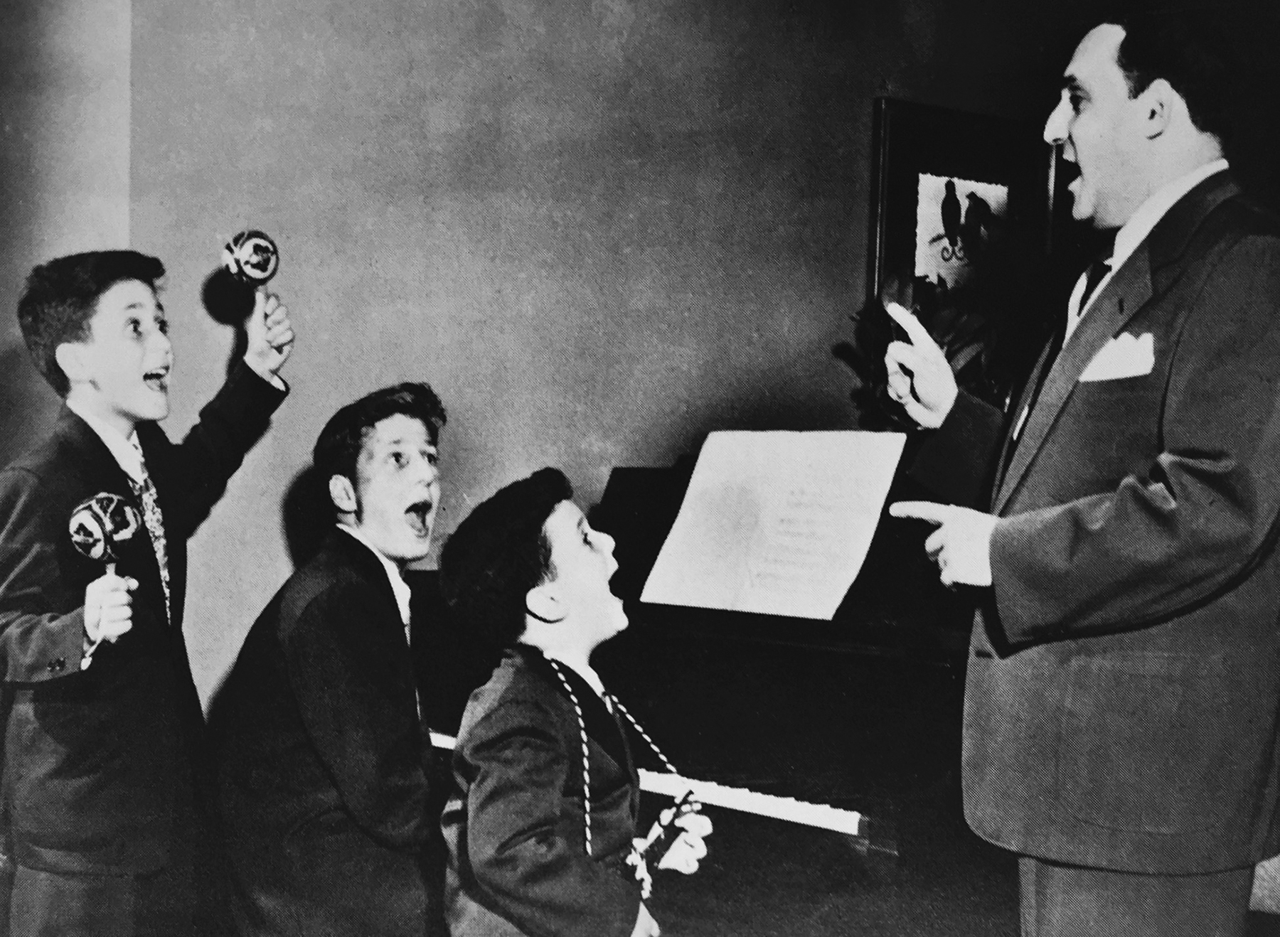  With my brothers Barry ( center ) and Henry ( right ), I play the mariachis as we follow our father’s conducting.  (By permission of Elizabeth Winston and James A. Drake) 