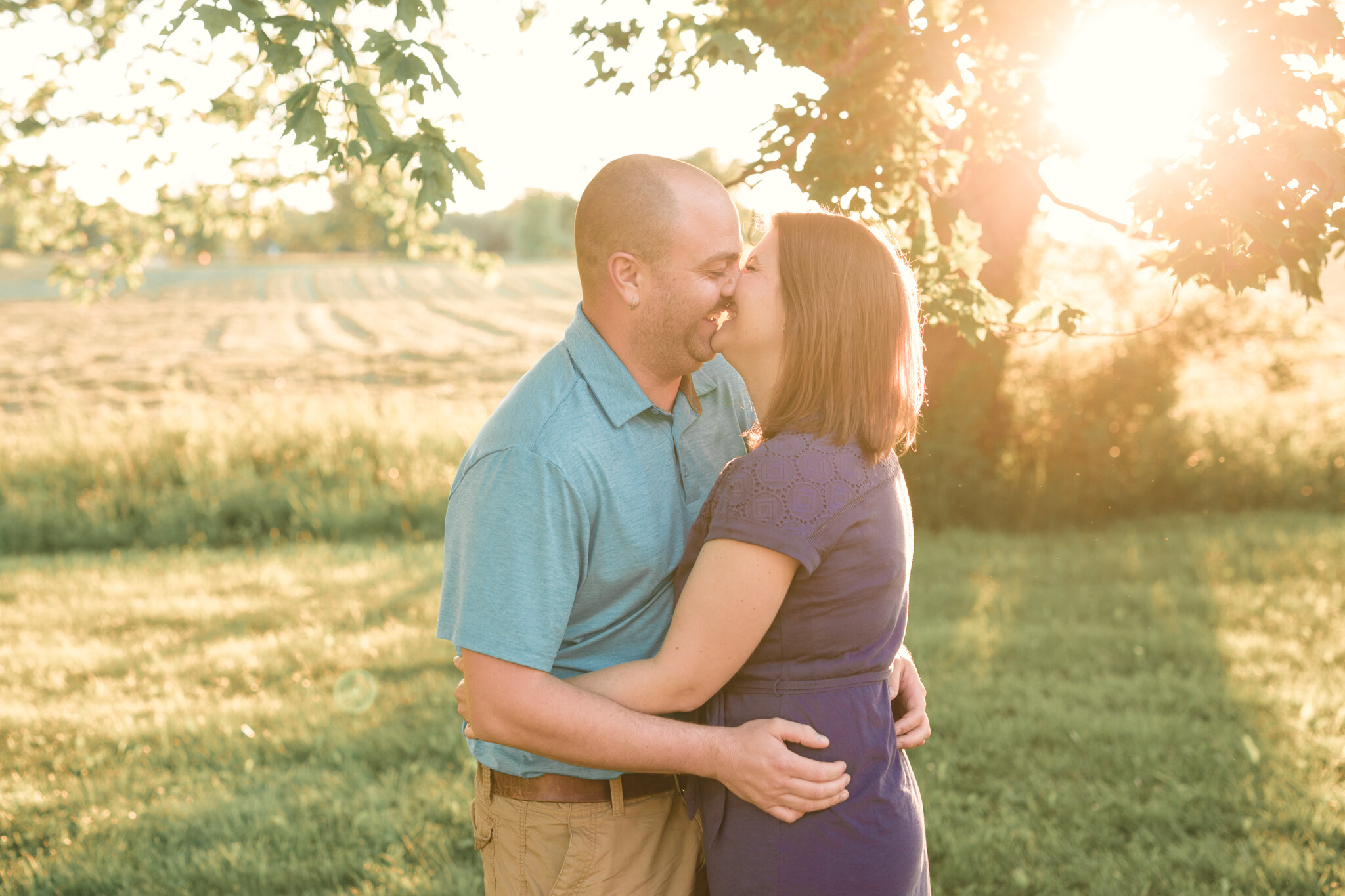 outdoor_front_porch_family_session_country_setting_family_of_four_photos_smiley_kiss_couple_by_trumbull_county_photographer_christie_leigh_photo_in_lake_milton_ohio-2.JPG