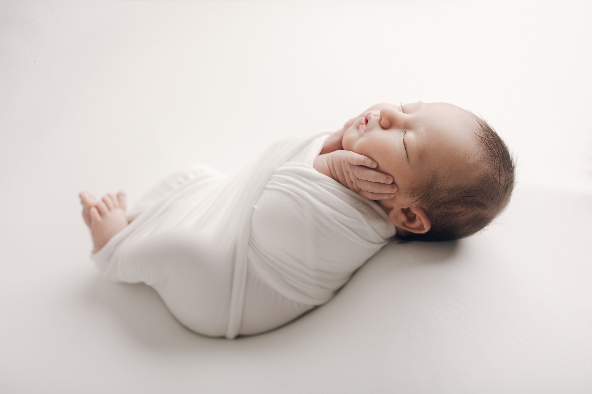 Newborn_Baby_Boy_Bright_White_Studio_Posed_Pretzel_Wrap_Wrapping_By_Newborn_Photographer_Christie_Leigh_Photo_in_Warren_OH_Ohio_Trumbull _County-1.jpg