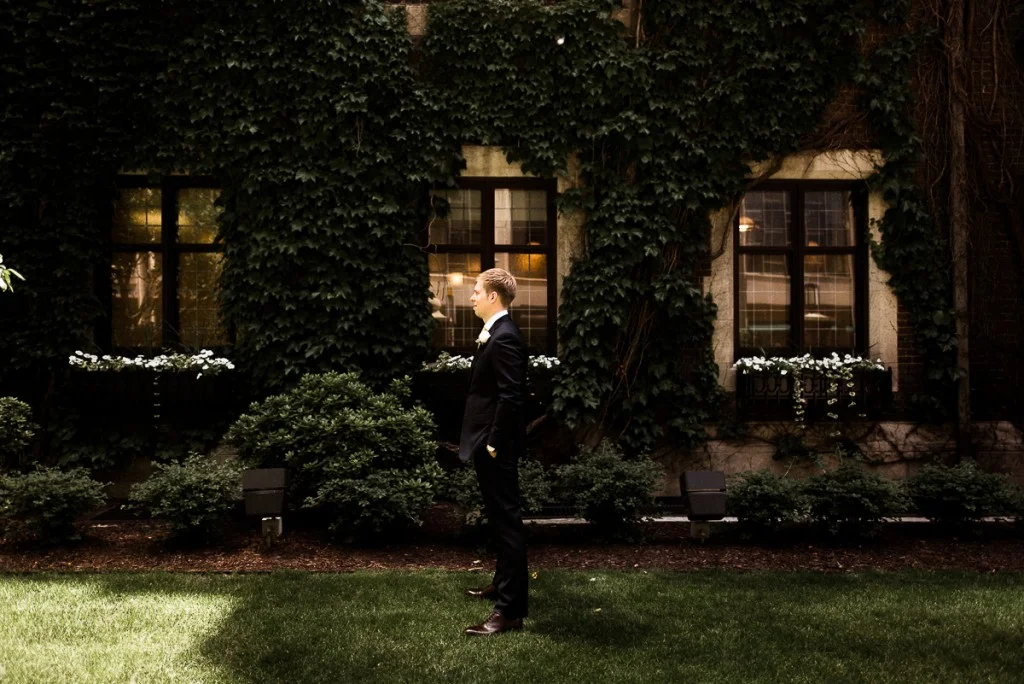 Groom awaiting bride for first look outside the Minneapolis club