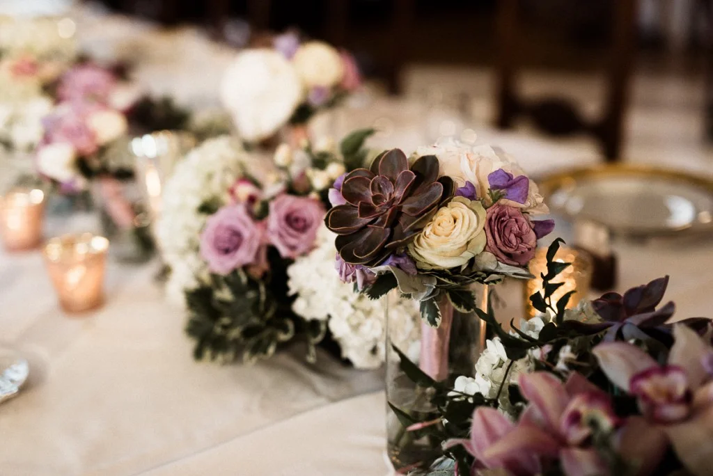 Purple, white and grey centerpiece with succulents at Minneapolis Club