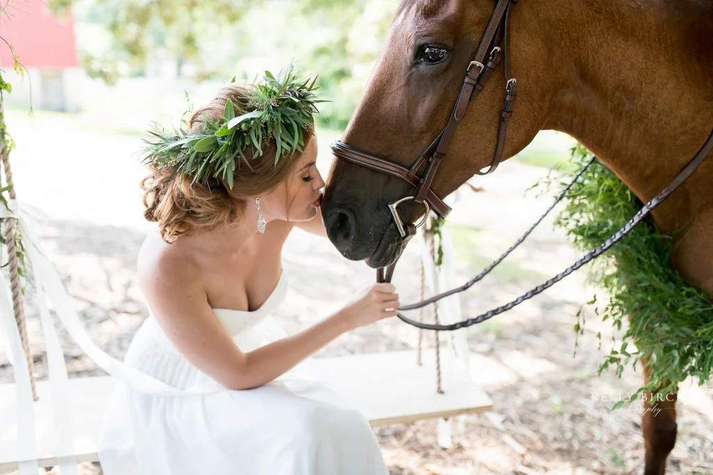 Bride kissing horse