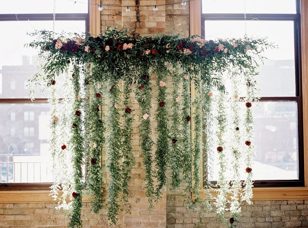 Floral installation with garland and fresh flowers for Day Block Event Center Wedding