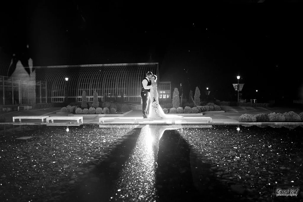 nighttime shot of bride and groom at Como Park Zoo and Conservatory