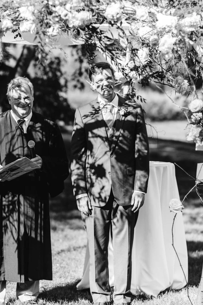 Groom's first look of bride walking down the aisle