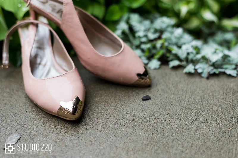 Blush wedding shoes with gold pointy cap toe