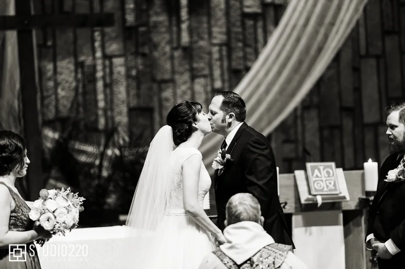 Pax Wedding ceremony kiss at Christi Catholic Community
