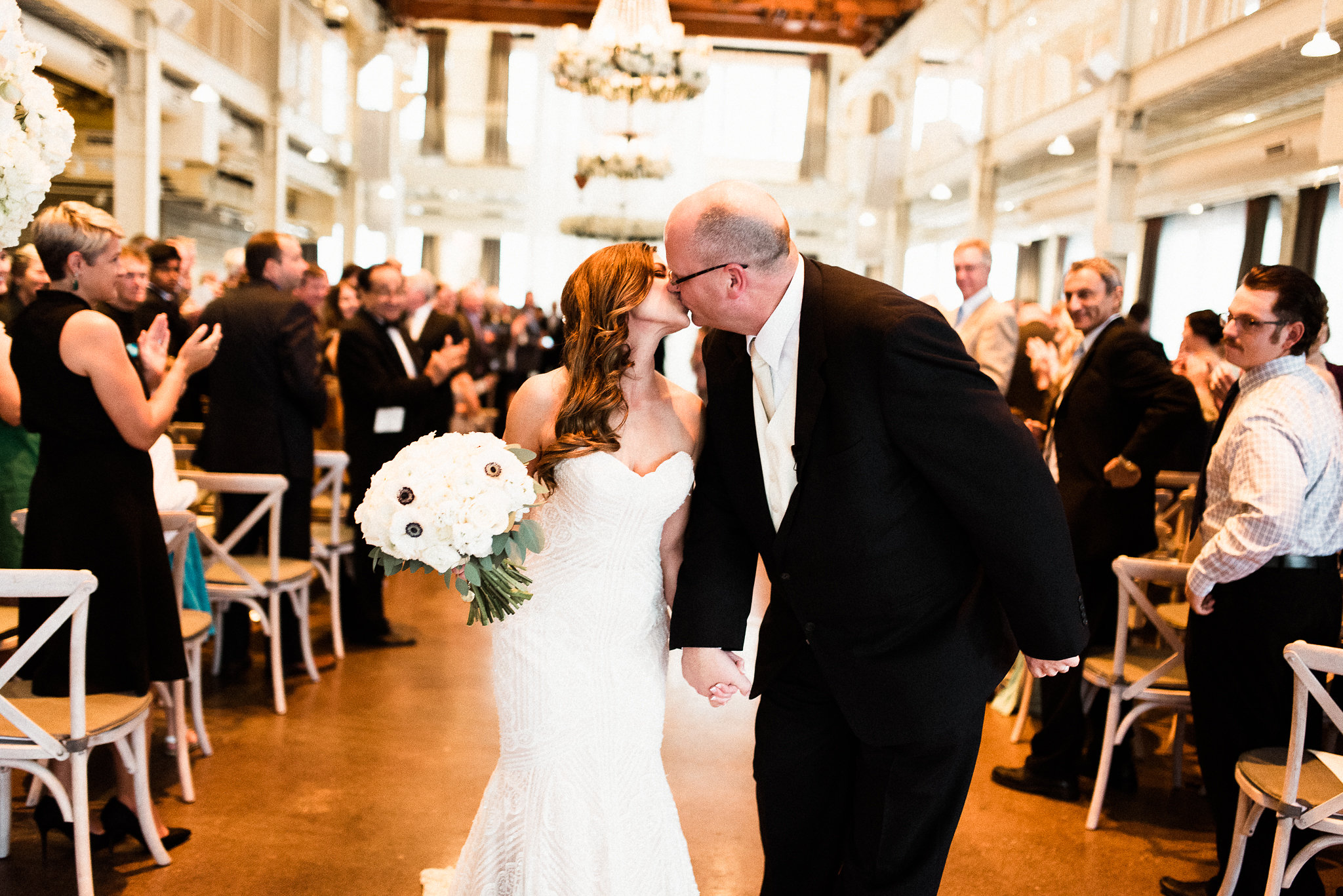 bride and groom kiss at their ceremony