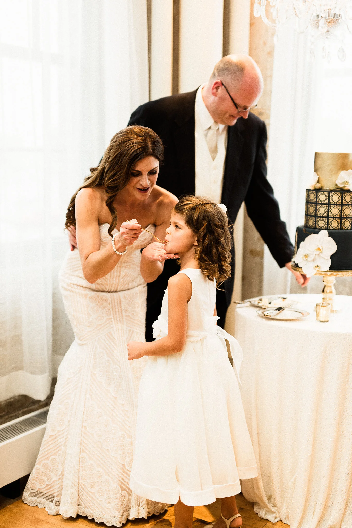 bride and groom cutting their cake