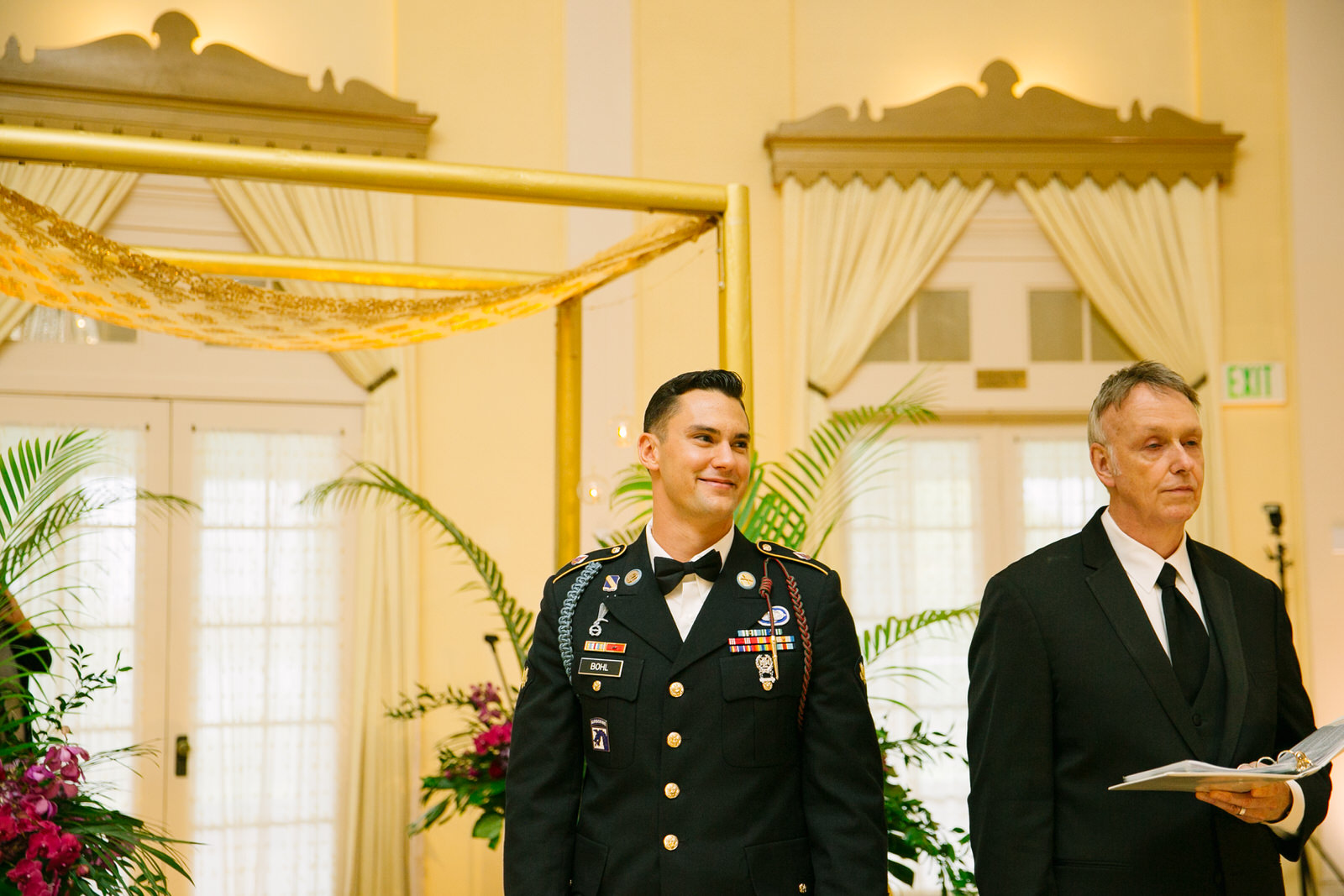 groom watching the bride walk down the aisle