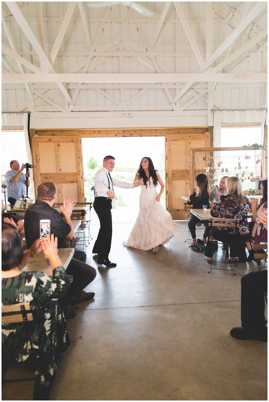  bride and groom entering their reception at the Legacy Hill Farm 