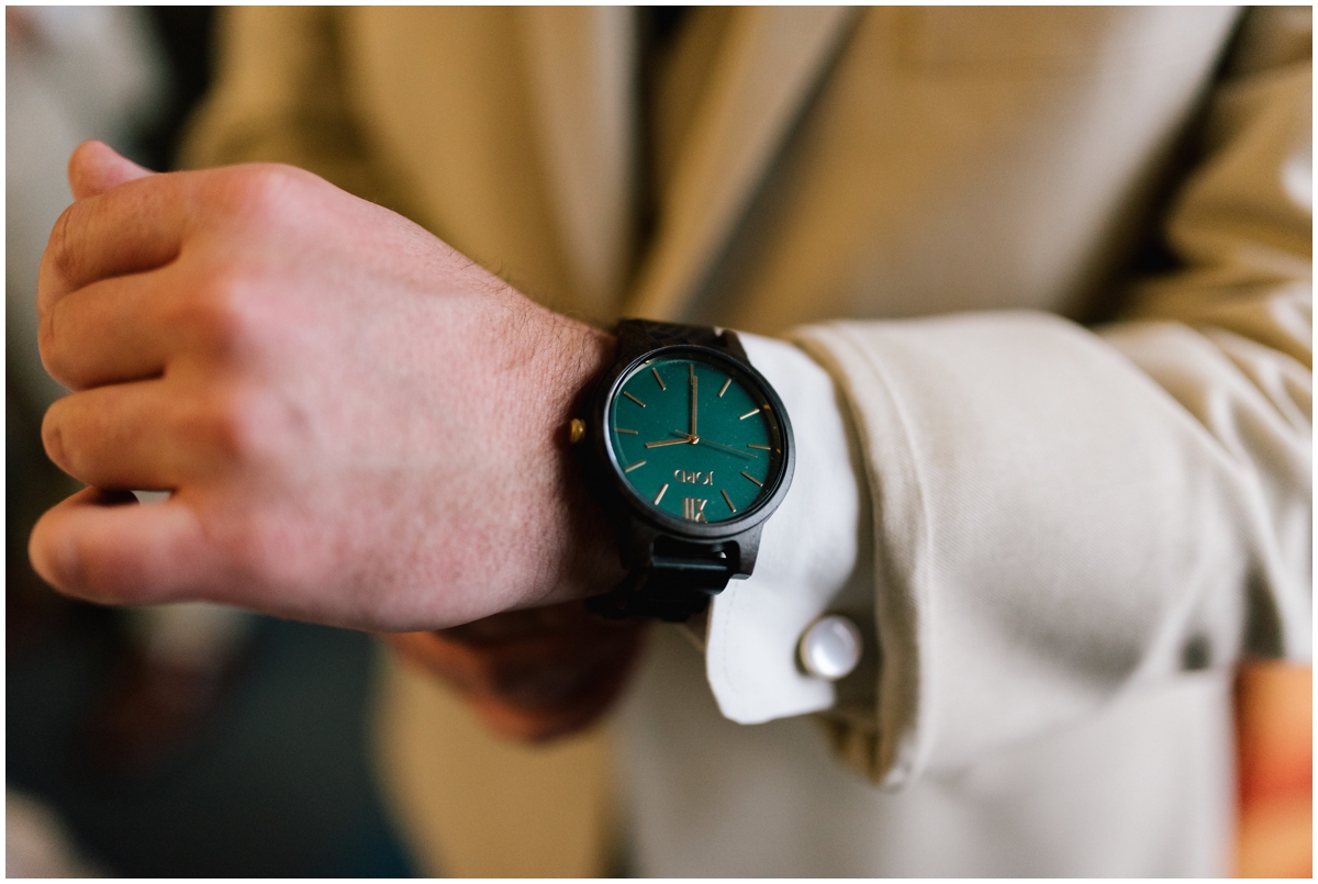 Groom wearing a greenery, fashion forward watch