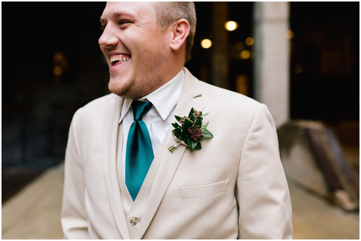  Groom with a greenery tie and boutonneire 