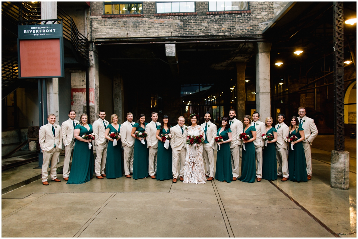 Bridal party with greenery dresses and ties.