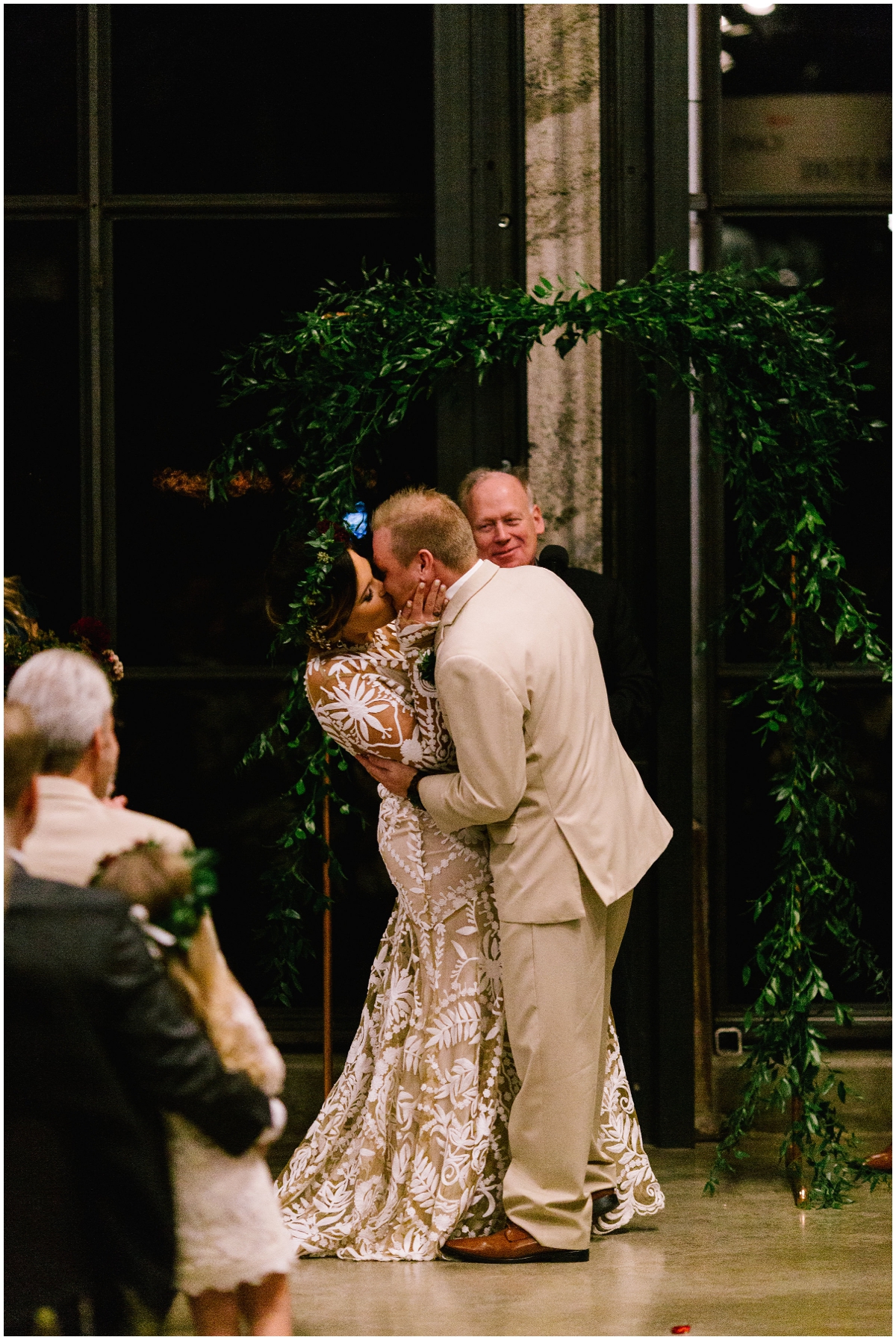  Bride and groom kiss at their ceremony 