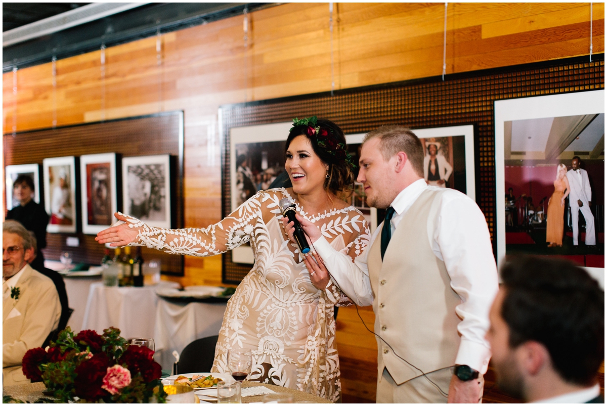 Bride and groom at their greenery and burgundy themed wedding