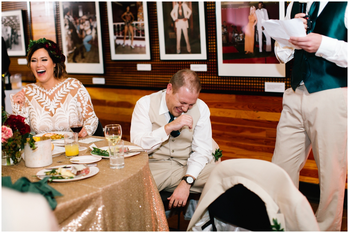  Bride and groom laughing at their wedding reception 