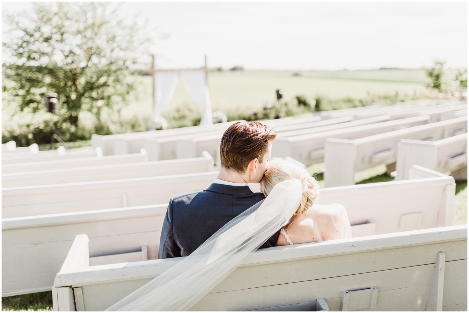 bride resting her head on groom’s shoulder