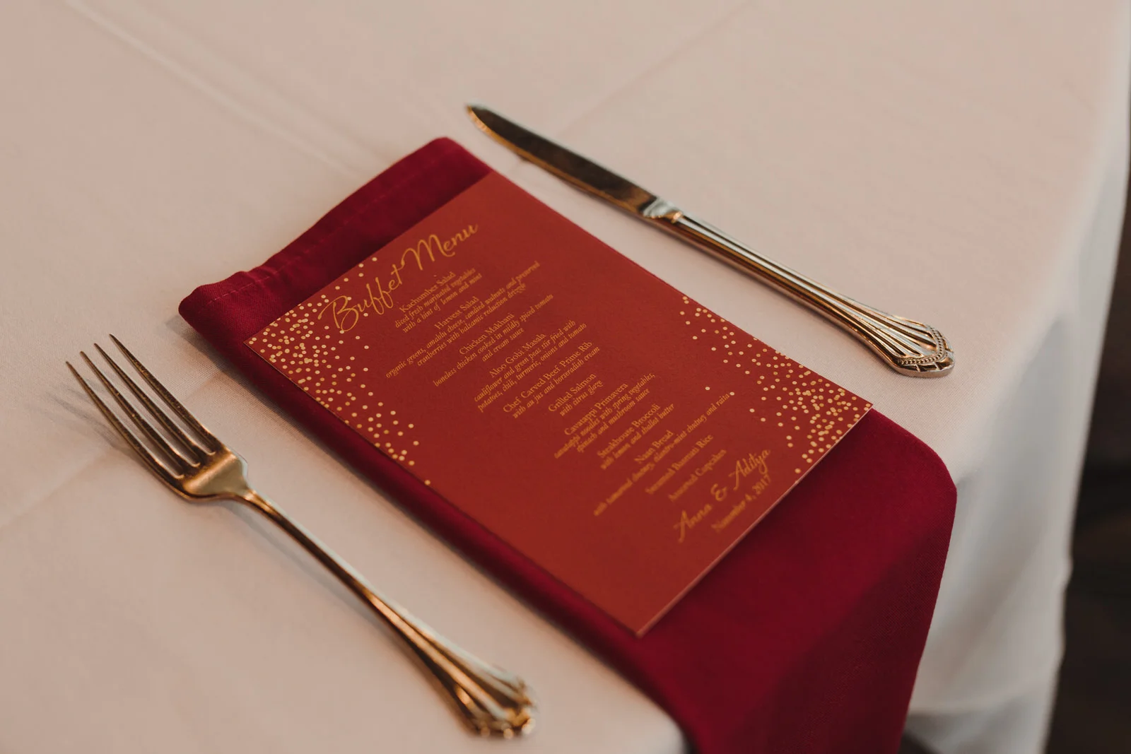 red tablescape and menu for wedding