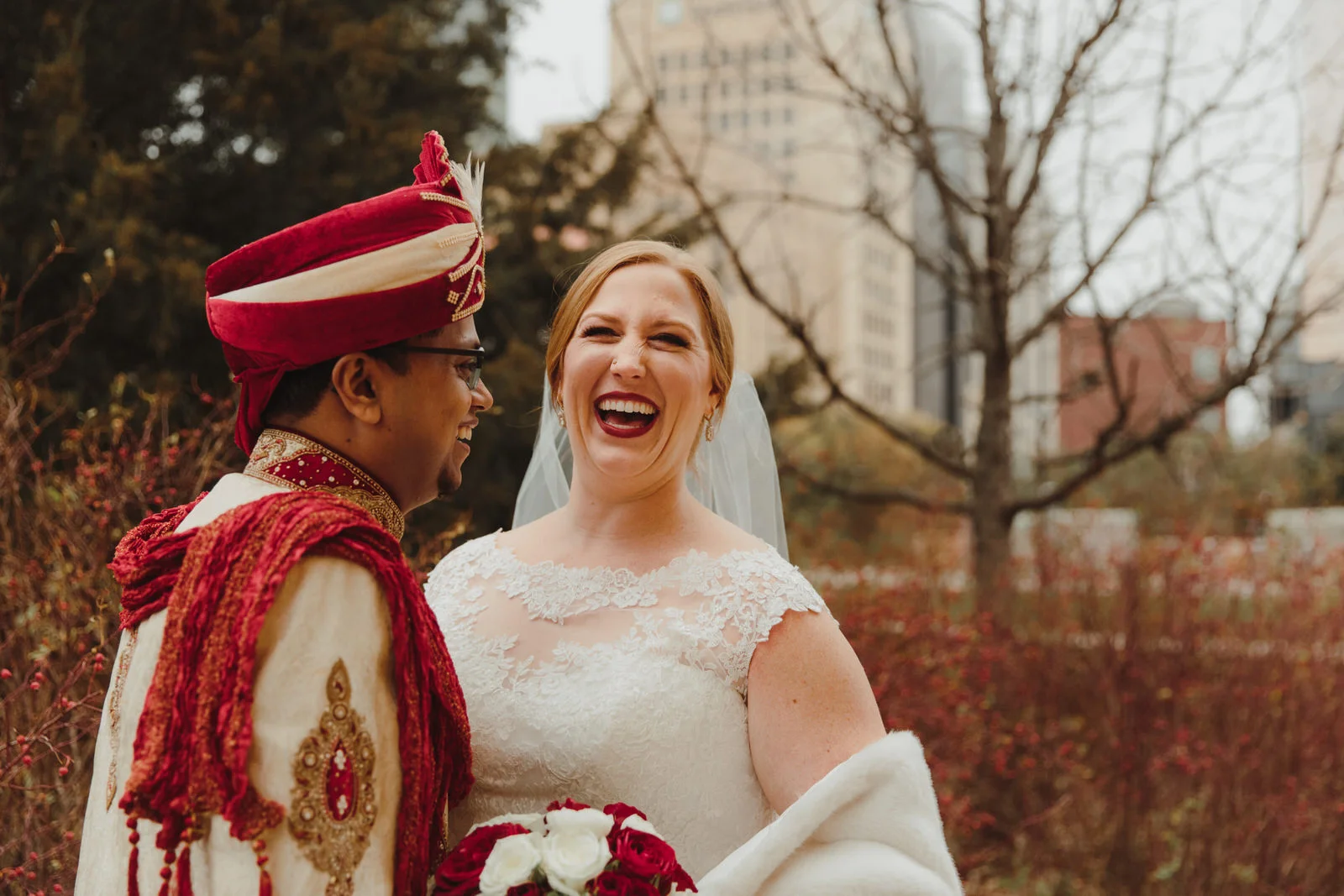 bride and groom laughing
