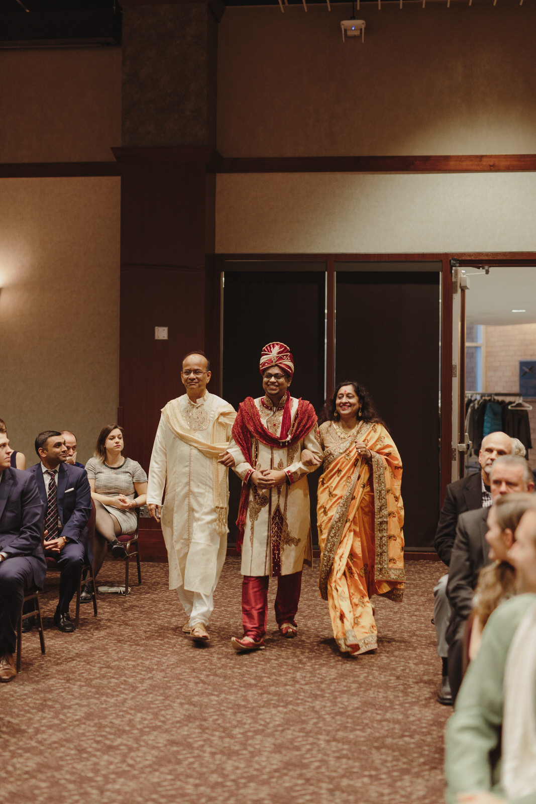  parents walking groom down the aisle 