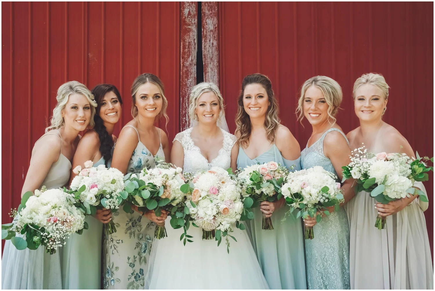 Bridesmaids and bride holding wedding bouquets