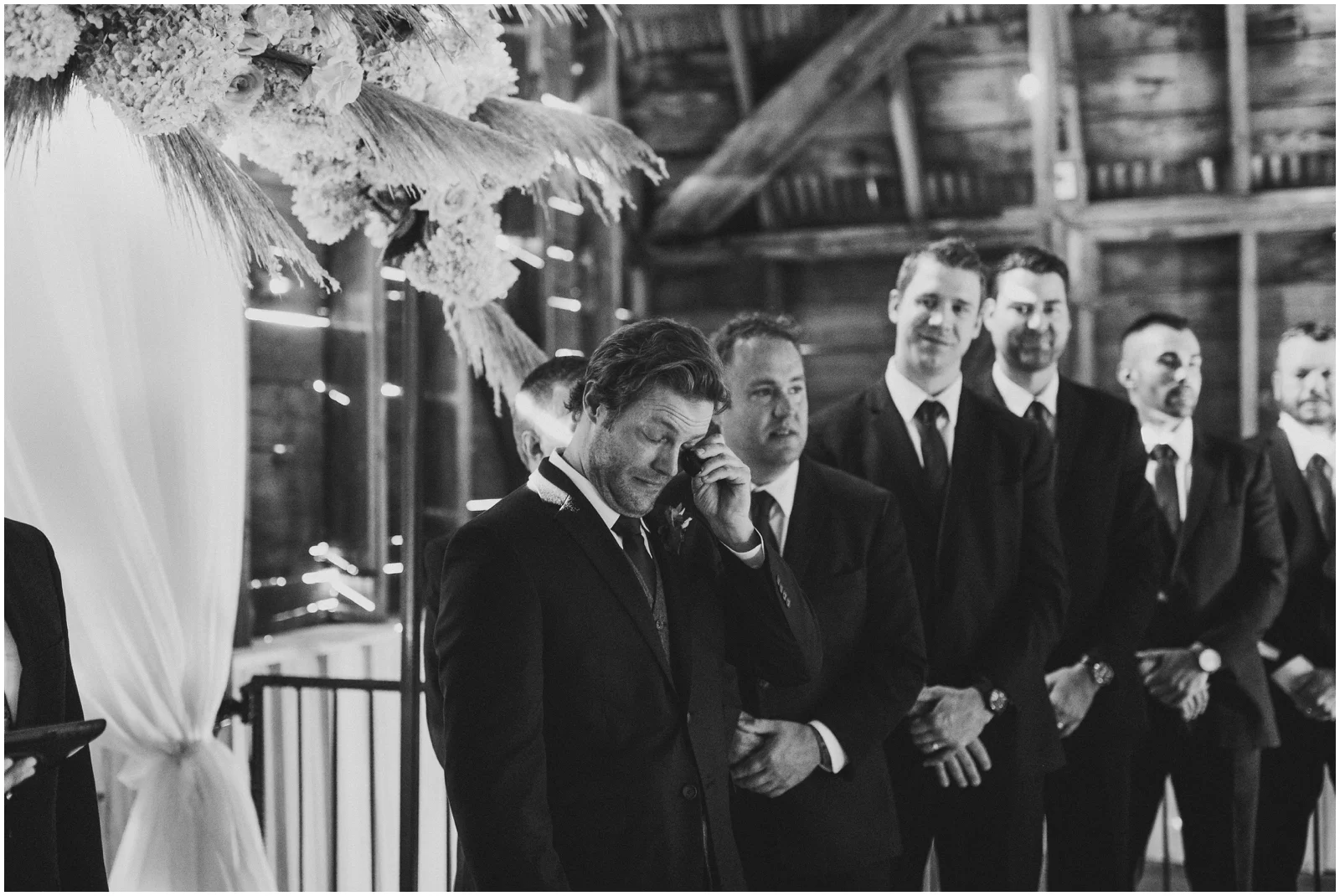 groom crying during his wedding ceremony
