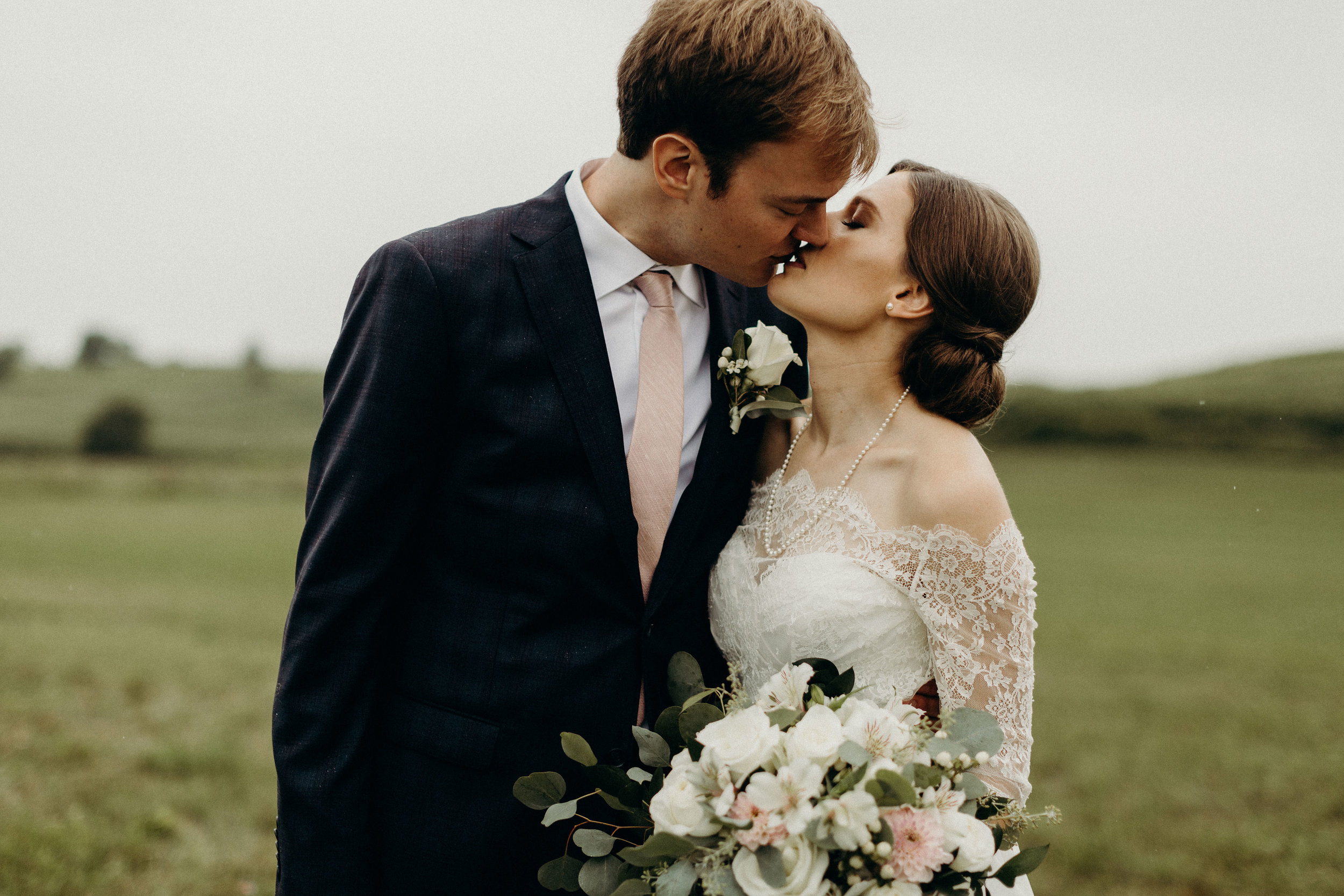  Bride and groom kiss before their wedding 