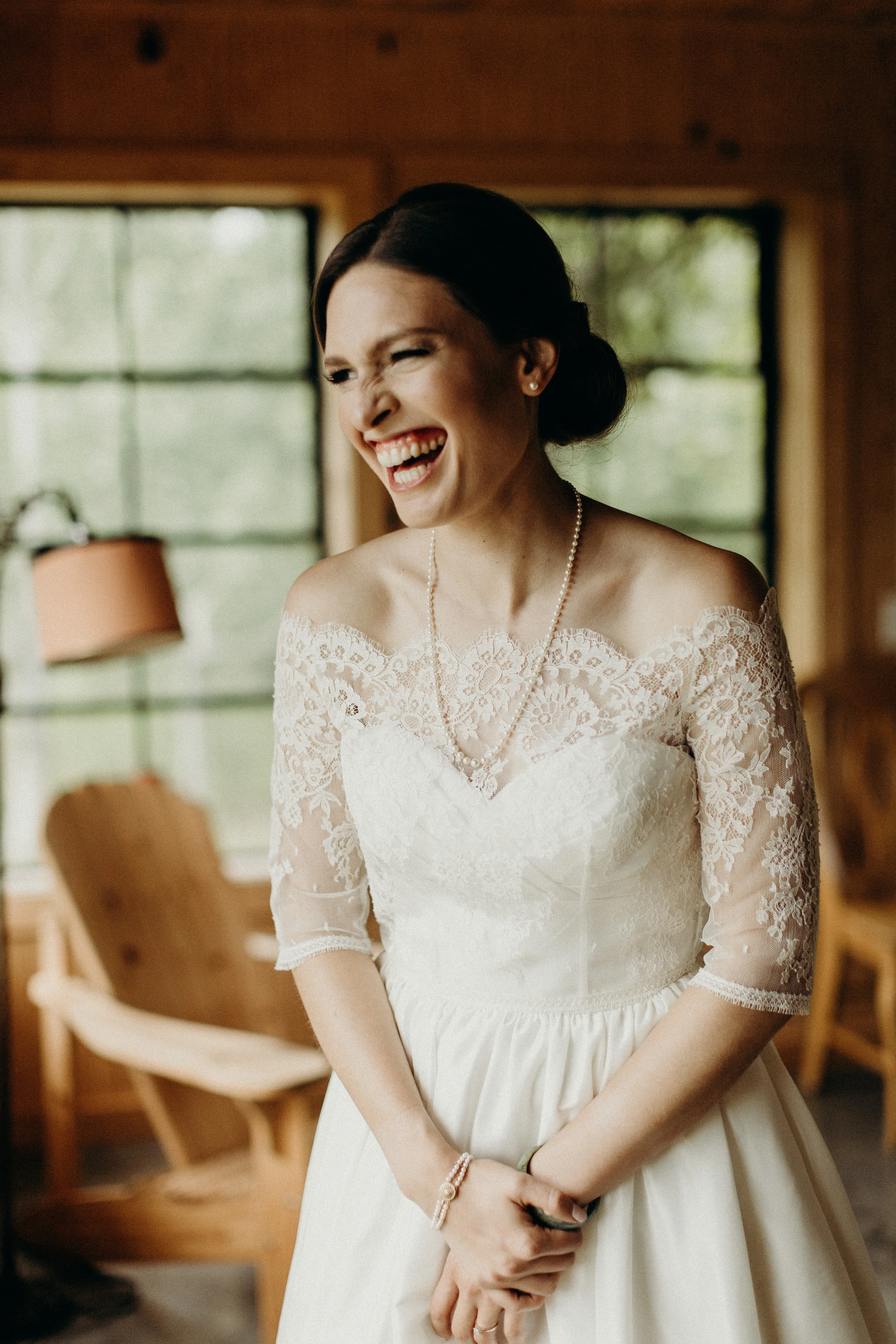 Bride smiling on her wedding dress