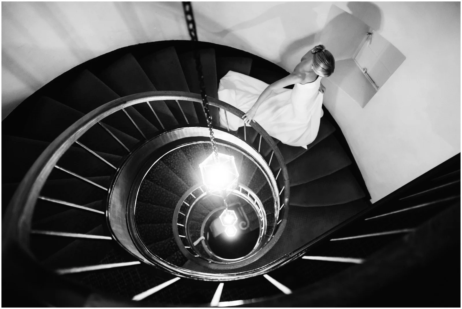 Minnesota Wedding Planner. Lafayette Club Wedding. Bride walking down a stairwell