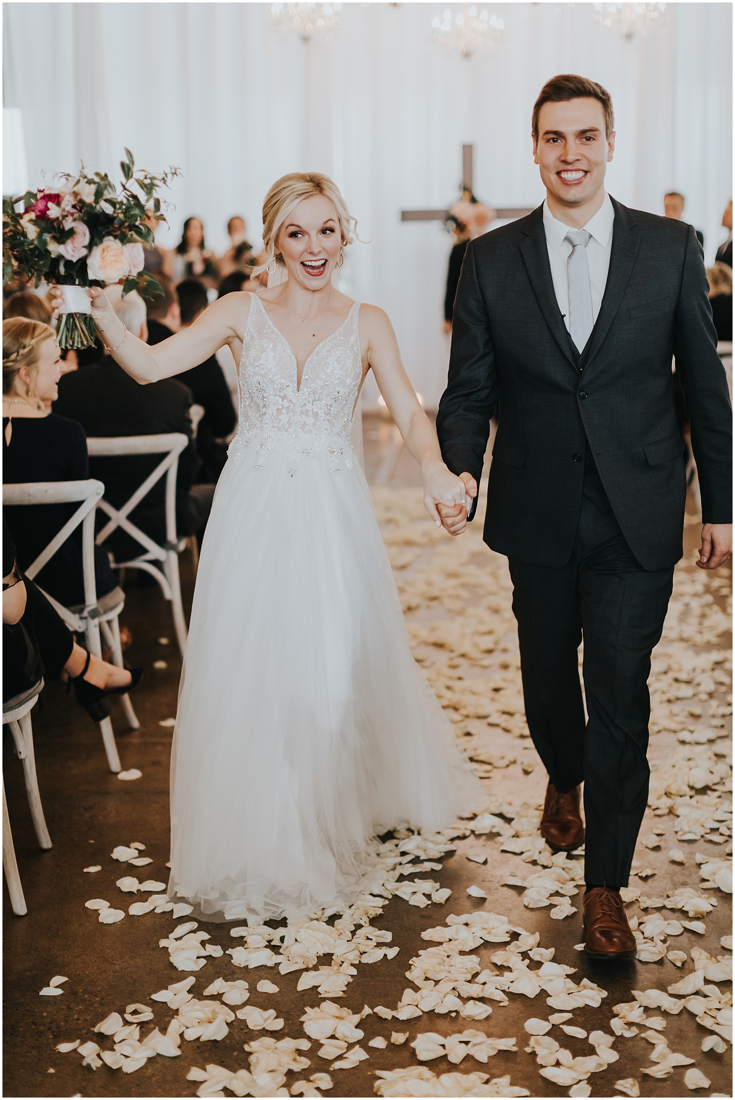  bride and groom smiling after their wedding ceremony 