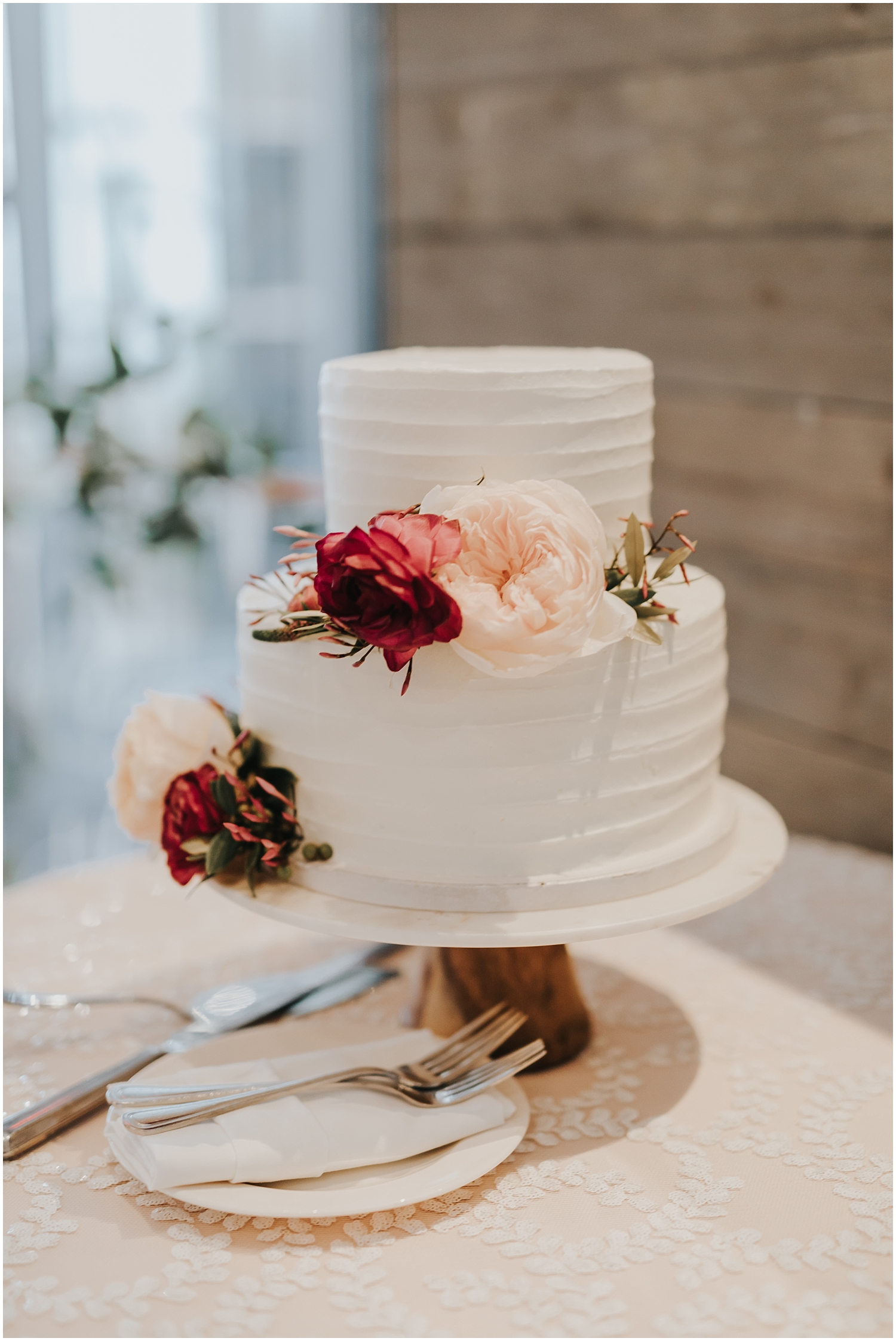 white wedding cake with floral decor