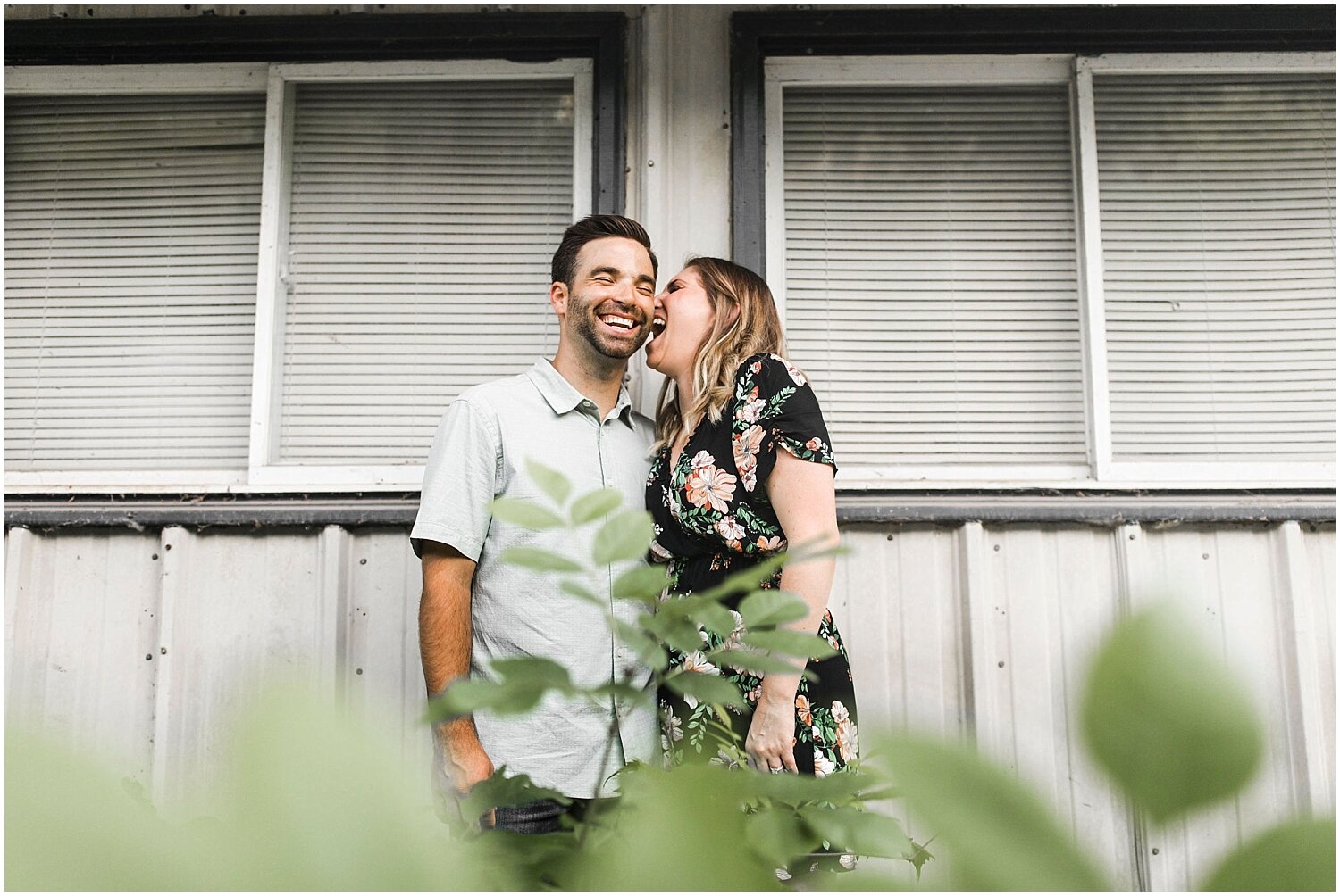  couple laughing during their engagement session 