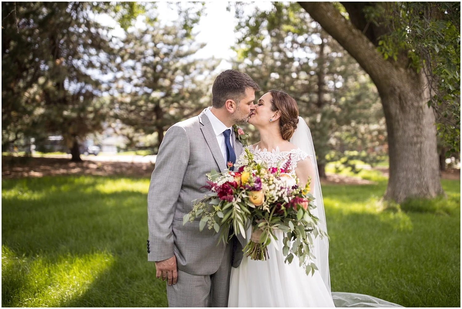 bride and groom kiss